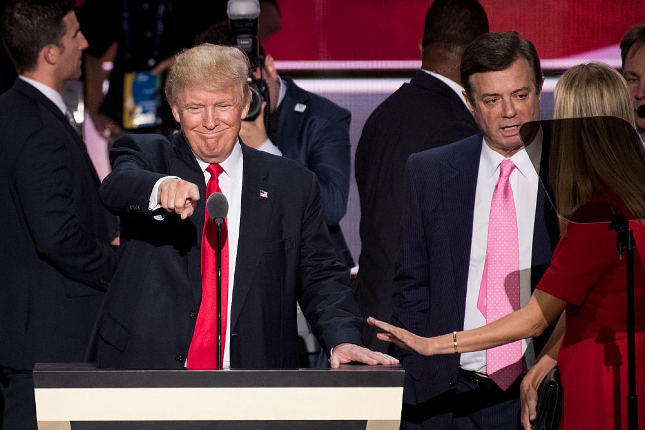 Donald Trump's former campaign manager Paul Manafort (r) has been named but denies any contact with Russian officials.