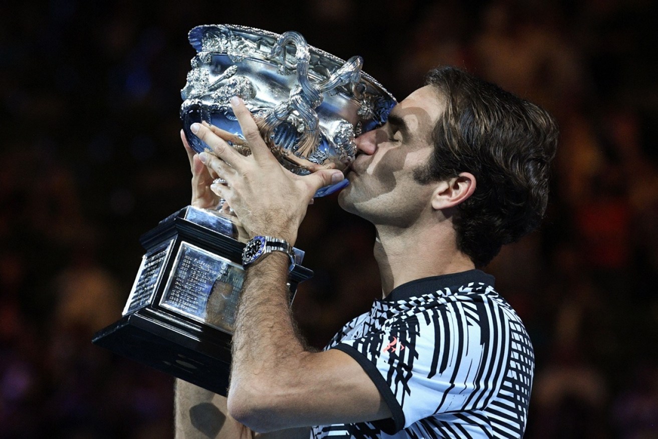 Roger Federer celebrates his 2017 Australian Open success.
