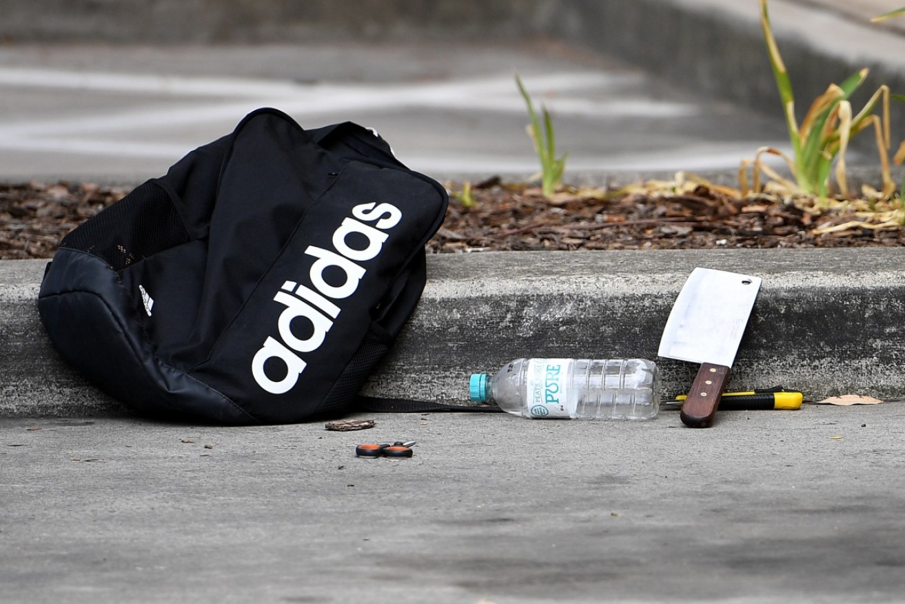 A backpack and knives and scissors are seen at a shopping centre adjacent to Bonnyrigg high school. 
