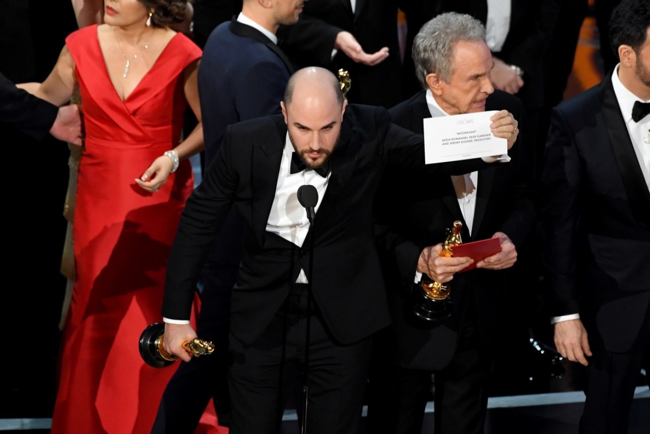 La La Land producer Jordan Horowitz holds up the winning envelope with 'Moonlight' as Best Picture.