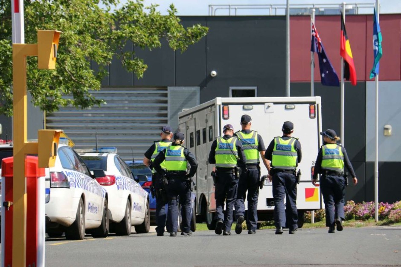 Police outside the Melbourne Youth Justice Centre at Parkville during a riot last year.