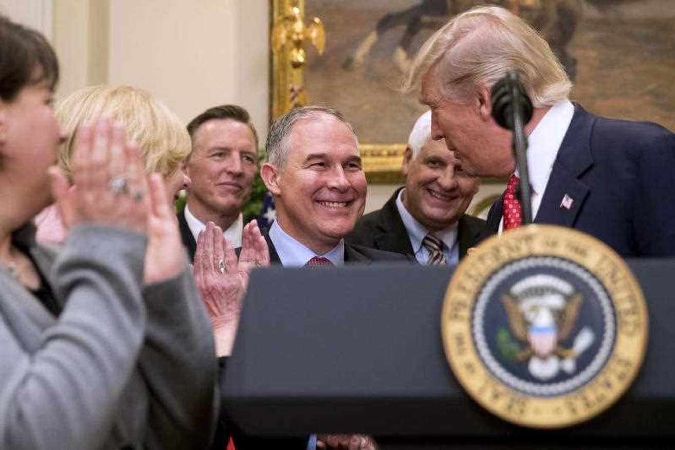 President Donald Trump shakes hands with Environmental Protection Agency (EPA) Administrator Scott Pruitt (c) last month.
