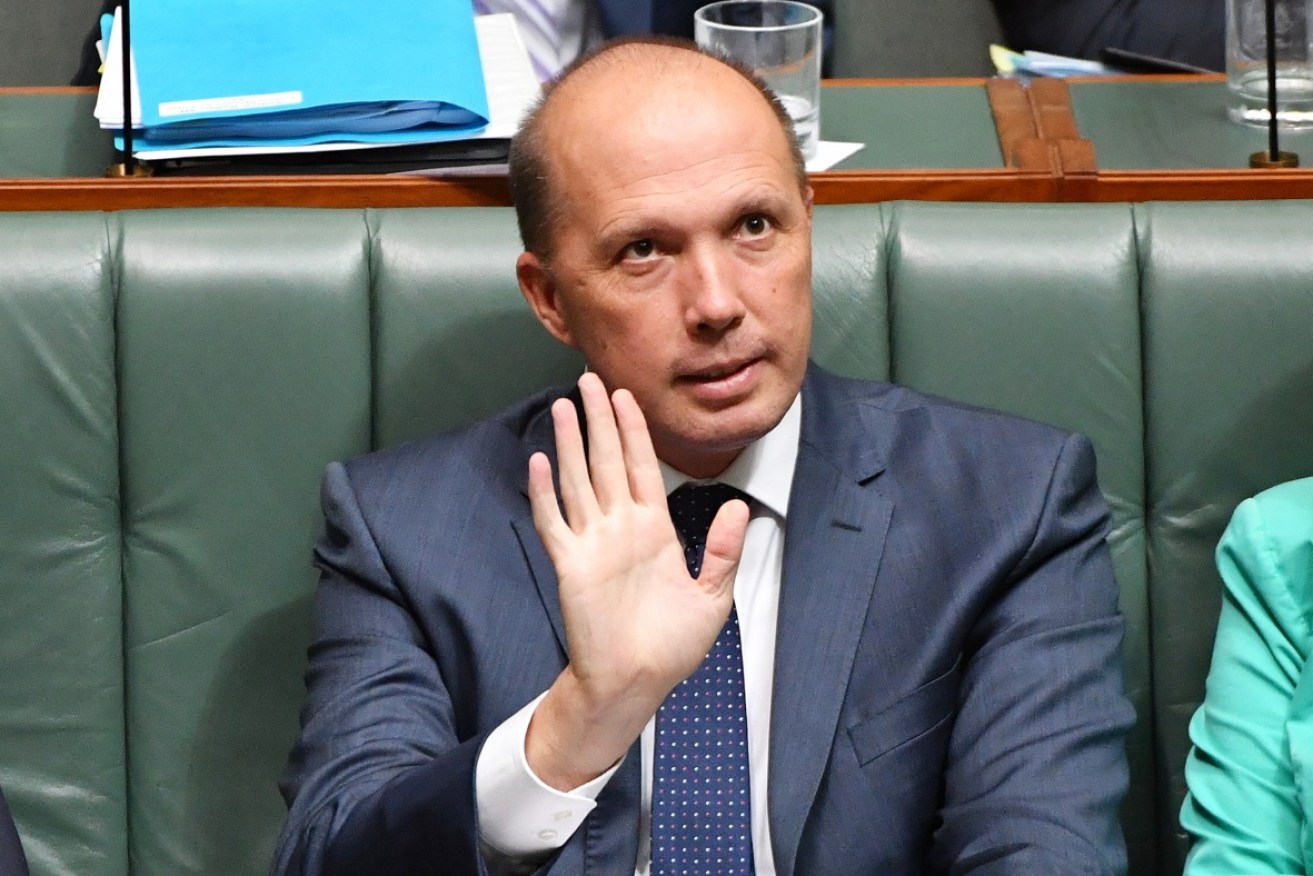 Immigration Minister Peter Dutton has refused to back down after he was contradicted by PNG police.
