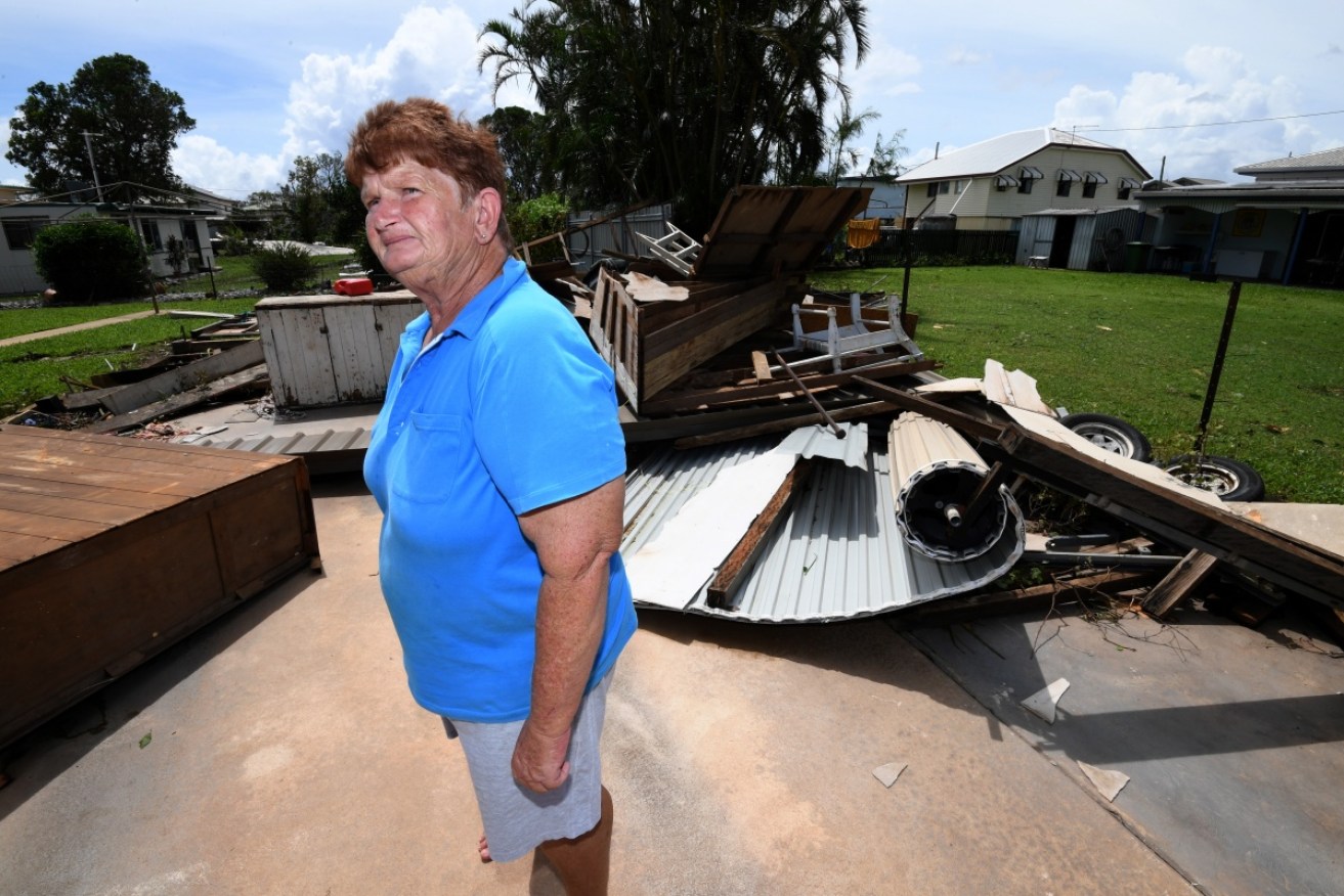 Helen Muller stands in the ruins of her double garage, built by her father, in Proserpine.