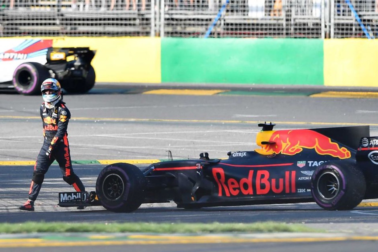 Daniel Ricciardo walks away from his stalled car after 29 laps.