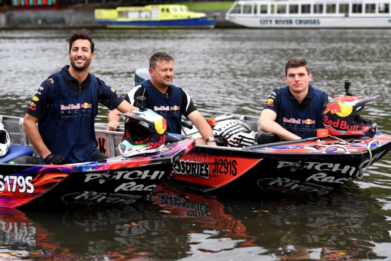 Daniel Ricciardo (L) and Max Verstappen (R) take to the Yarra River on race speedboats.