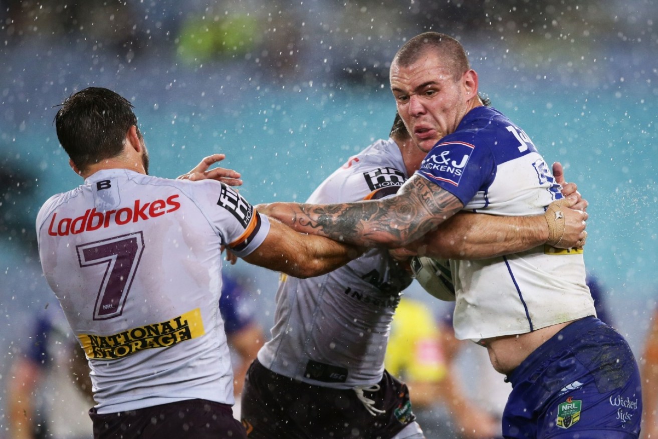 David Klemmer of the Bulldogs attempts to bust a tackle.