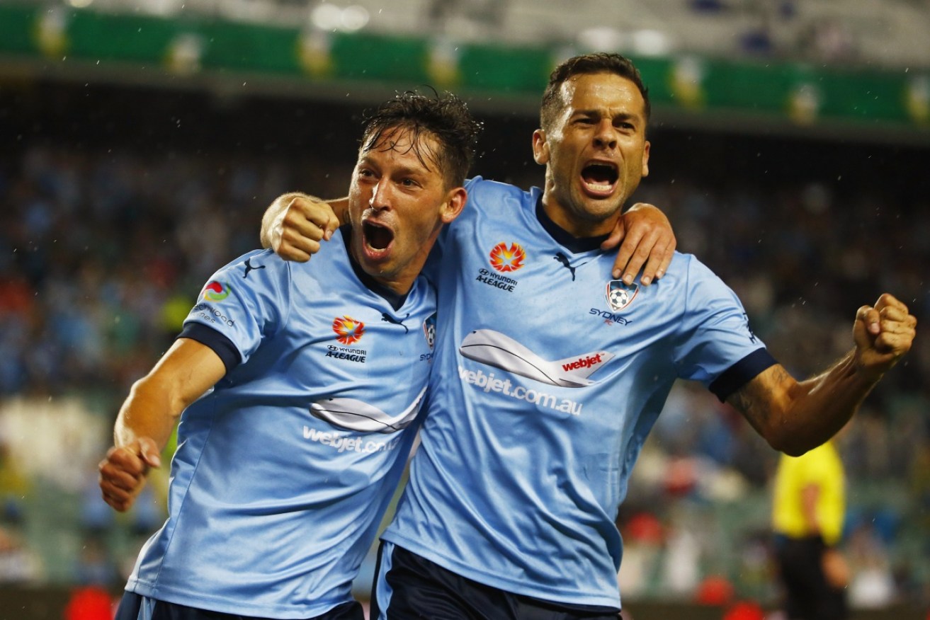 Sydney's Filip Holosko and Bobo celebrate victory over Melbourne in March - a result the favourites aim to repeat at Allianz Stadium.