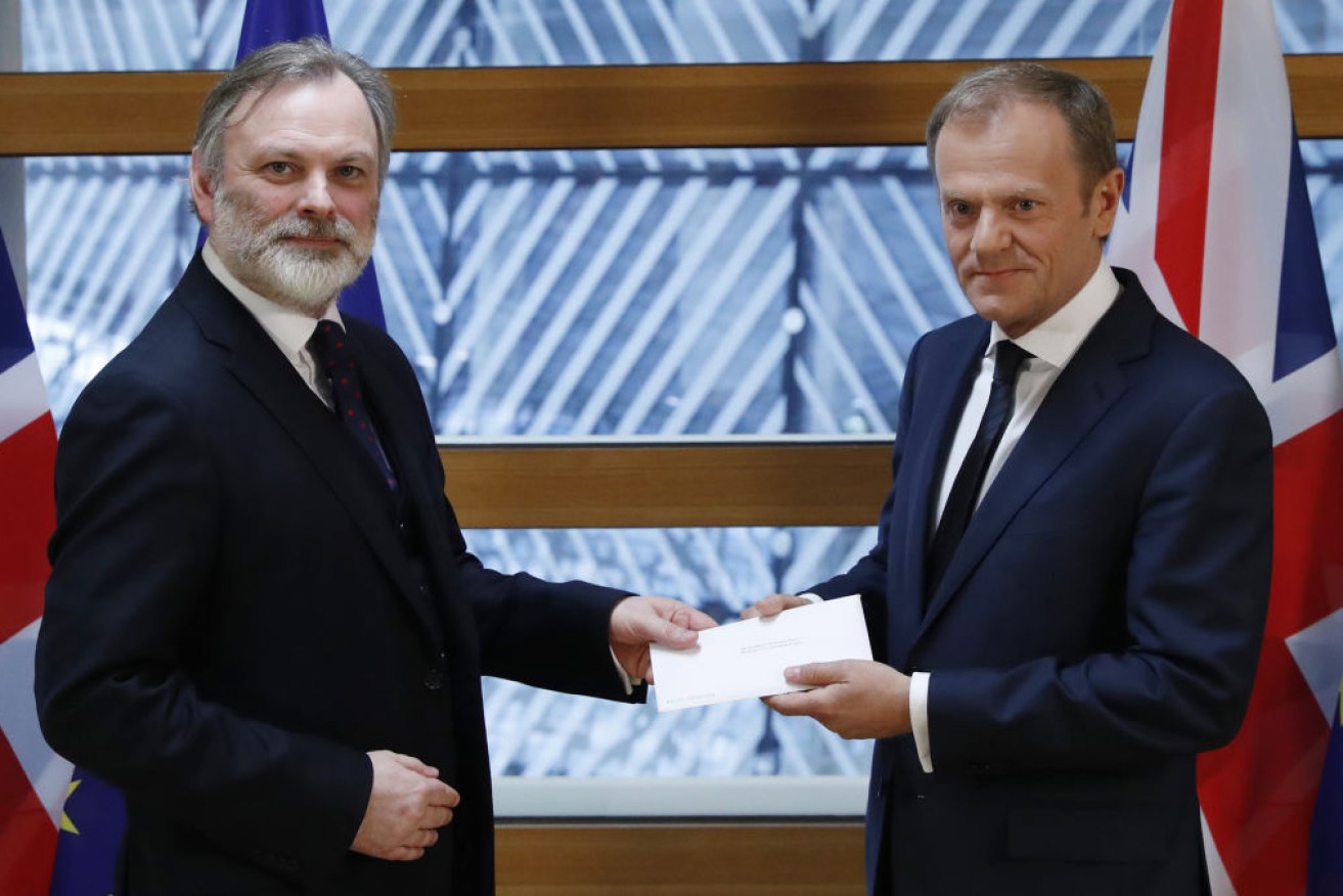 Britain's ambassador to the EU Tim Barrow (L) delivers notice of the UK's intention to leave to EC President Donald Tusk. 