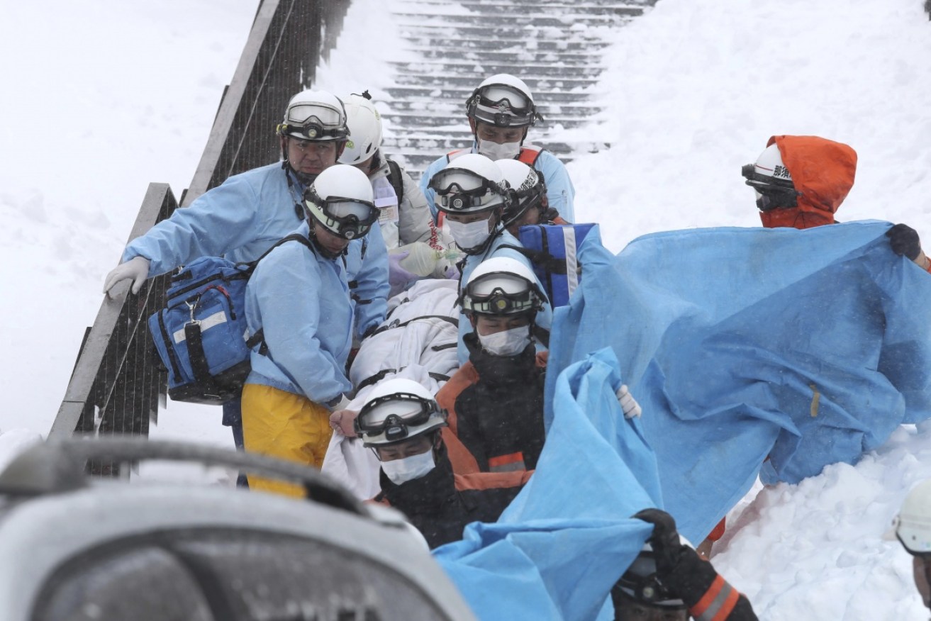Rescue workers are searching for missing students after an avalanche hit a ski resort in Japan.