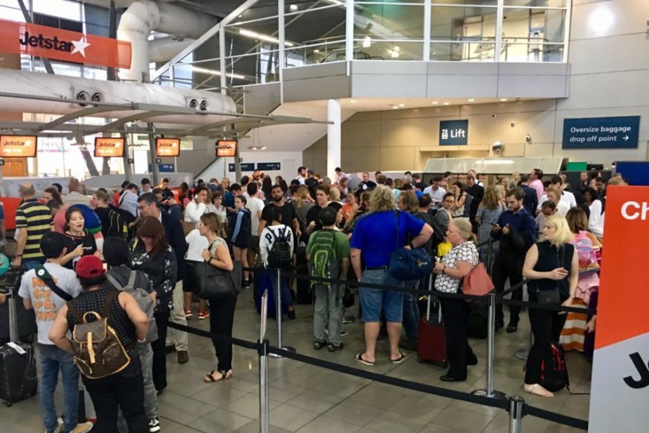 Long queues have formed at Sydney Airport with several flights cancelled due to the storm.