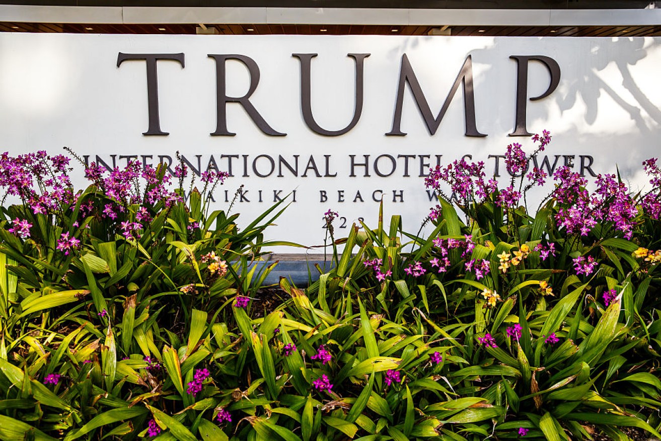 Entrance sign of Trump International Hotel at Waikiki Beach in Hawaii.