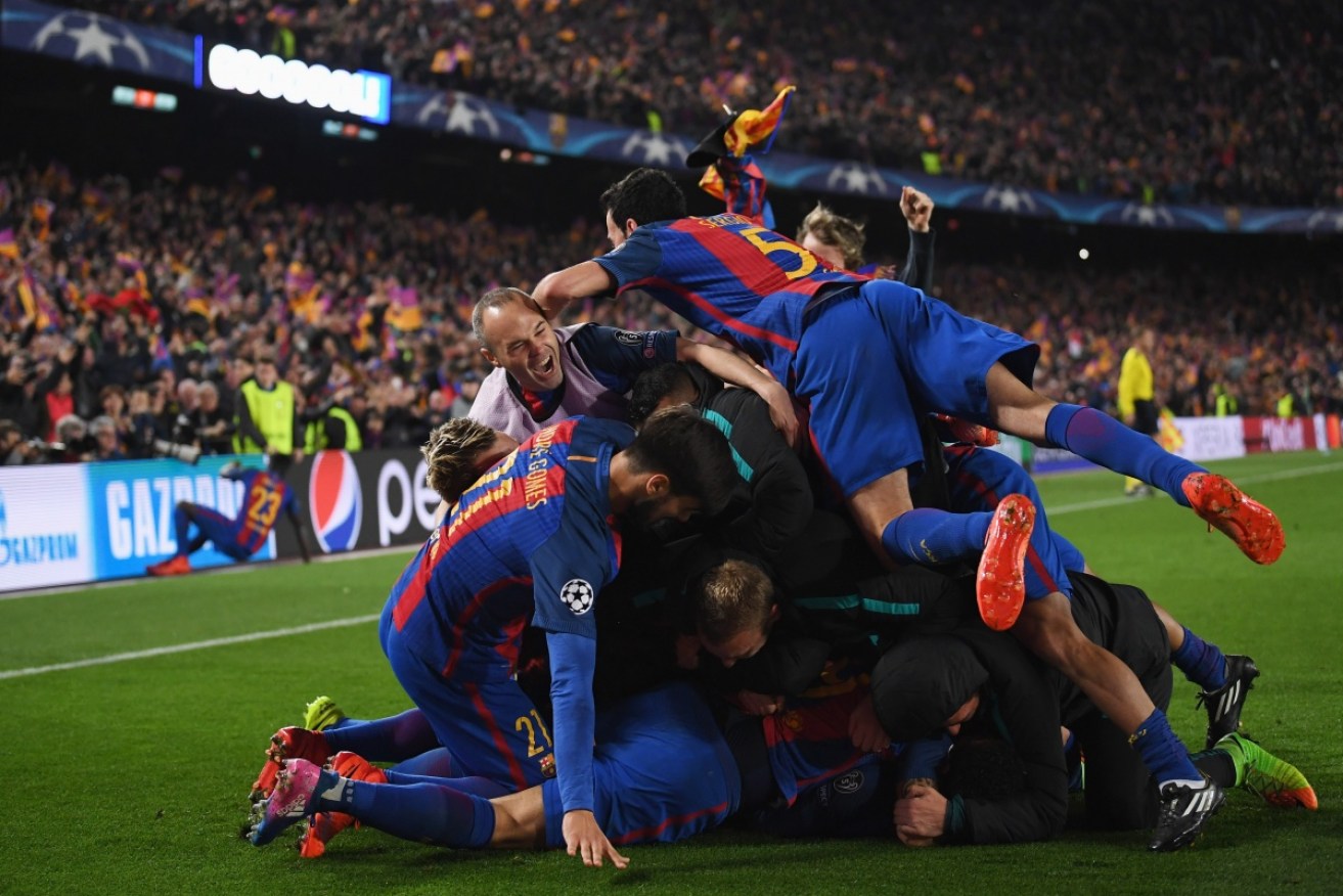 Barcelona celebrate the greatest Champions League knockout comeback of all time. 