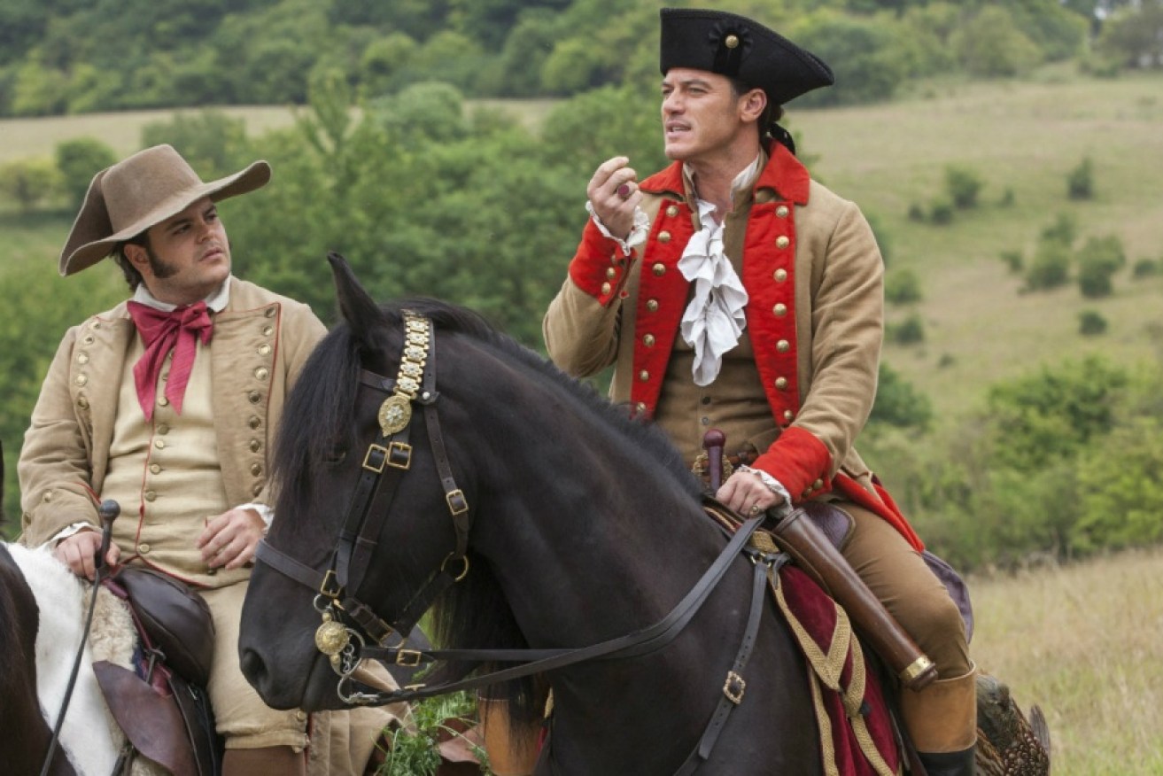 Josh Gad as Le Fou, left, and Luke Evans as Gaston in a scene from, "Beauty and the Beast,"