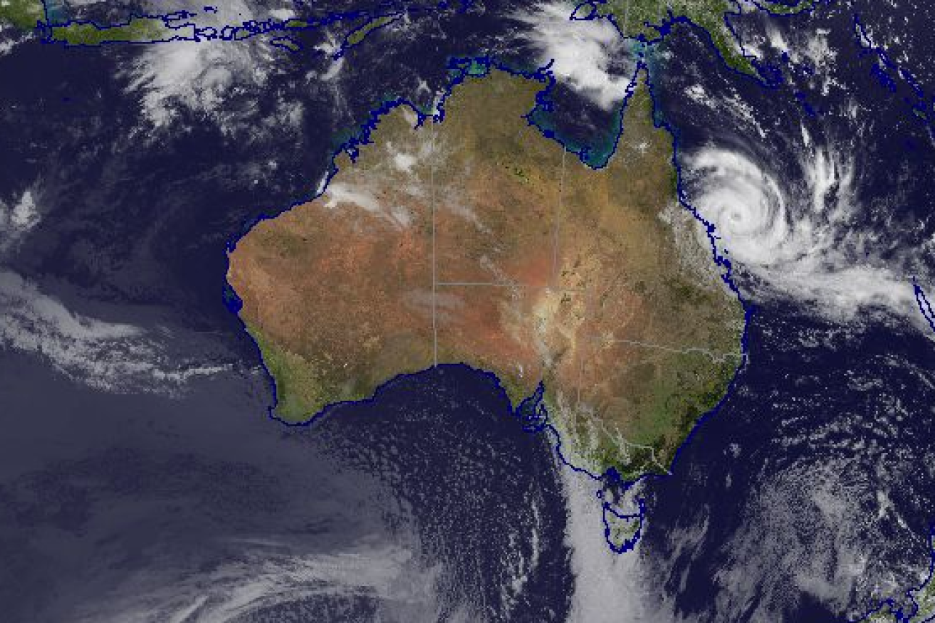 The cyclone can be seen on Monday morning gathering off the mid to north-Queensland coast.