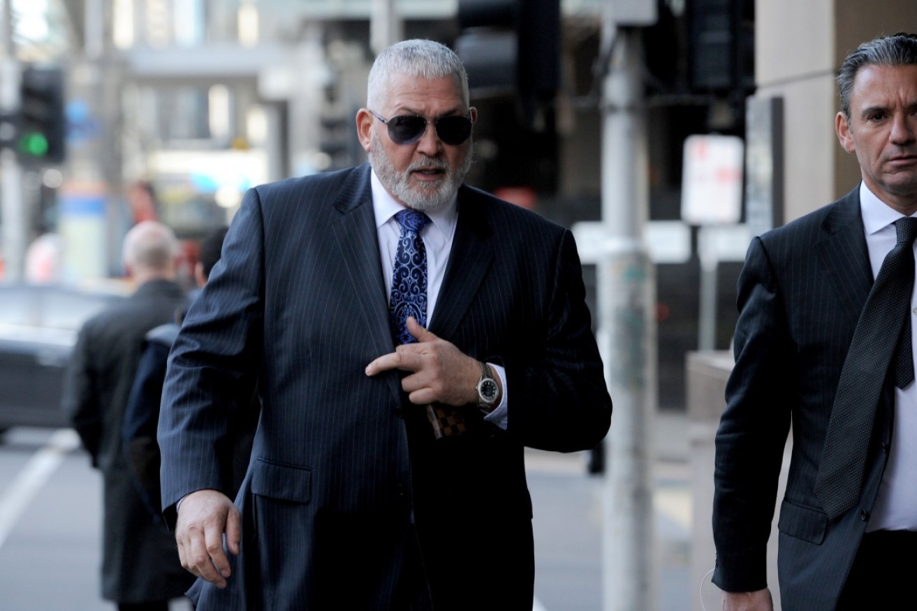 Underworld figure Mick Gatto is suing the ABC over a "hurtful" article that his lawyer say implies he is a hitman and murderer.