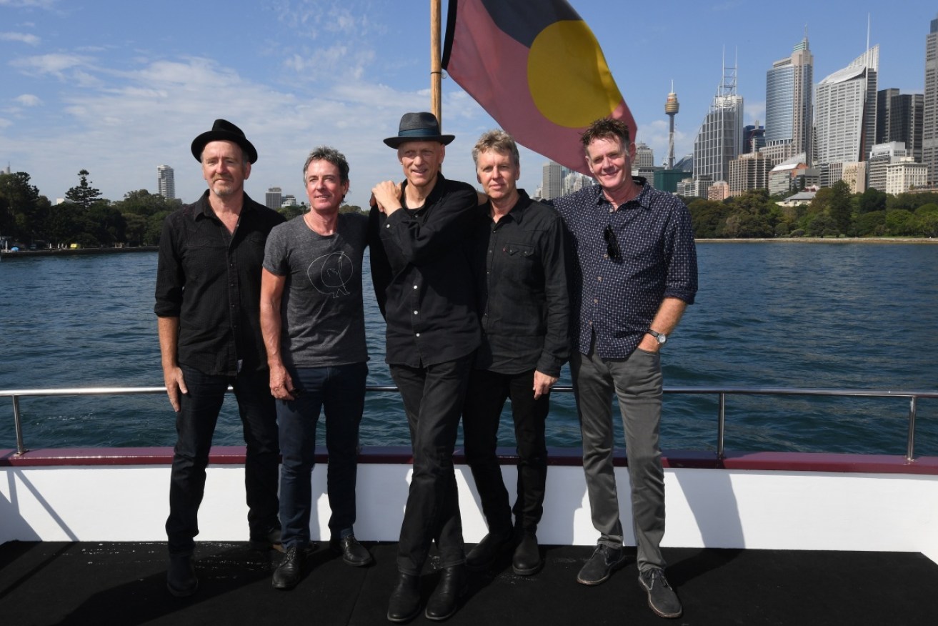 Midnight Oil has urged fans not to buy tickets from resellers.