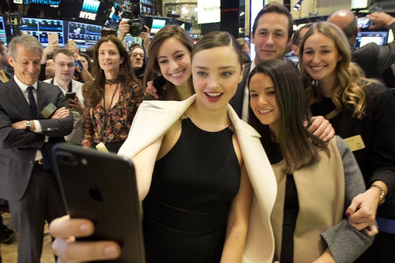 Miranda Kerr, who is dating Snapchat owner Evan Spiegel, attended the opening bell at the on Wall Street. 