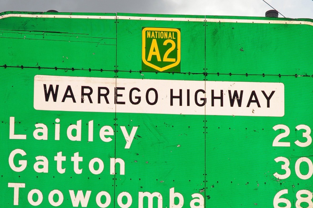 The woman was rescued on the Warrego Highway at Mitchell, in south-west Queensland.