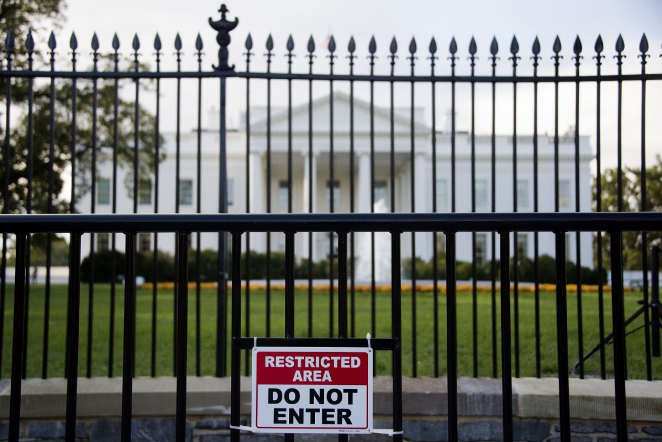 The White House is in lockdown after an intruder tried to jump the fence.