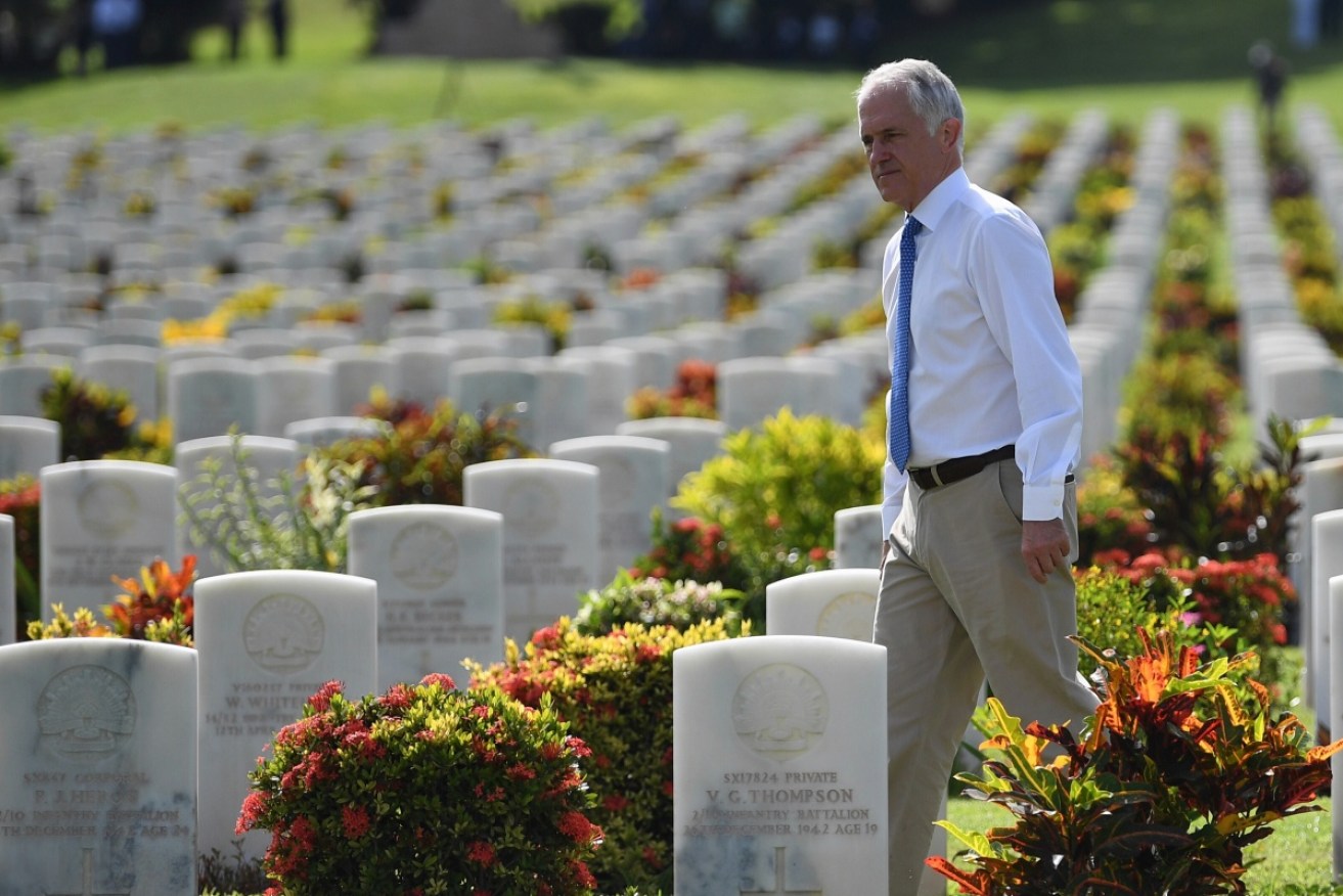 Mr Turnbull lays a wreath at the Kokoda track and visits the Bomana War Cemetery near Port Moresby on Saturday during his two-day visit. 