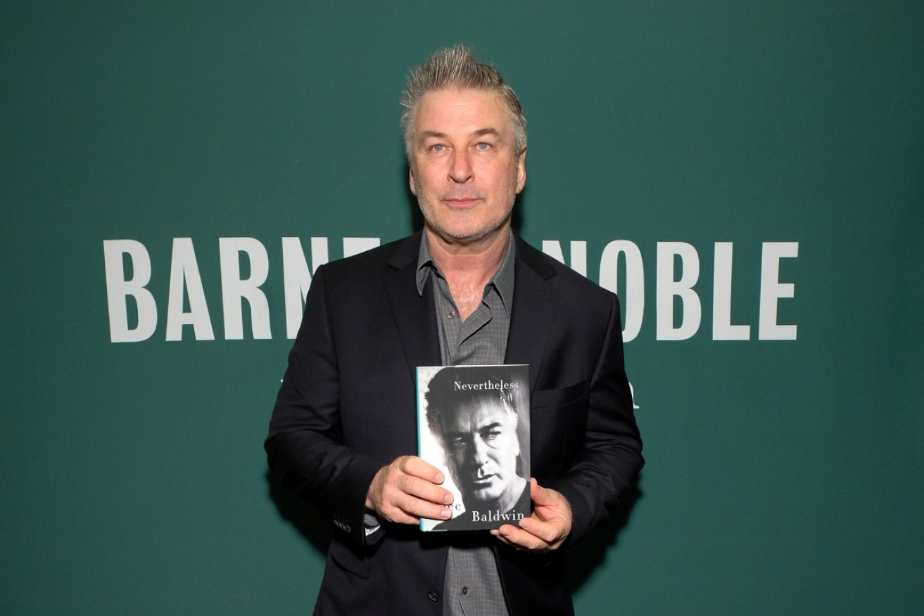 Alec Baldwin with a copy of his new book <i>Nevertheless: A Memoir</i>.