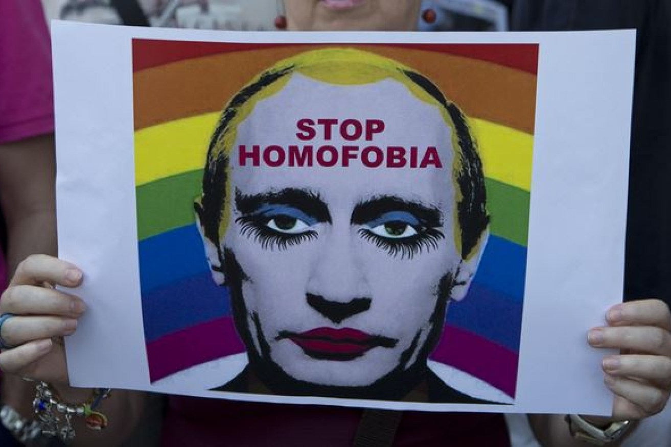 Putin's opposition to Russia's gay lobby spawned this poster - and a new law making it an offence to ridicule the Russian strongman.