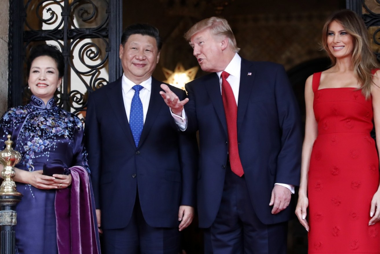 President Donald Trump talks with Chinese President Xi Jinping.
