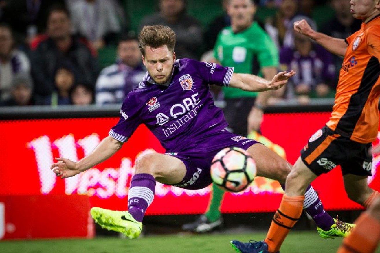 Roar's Chris Harold helps propel his side to a secure finals berth during last night's 3-1 A-League victory over Brisbane