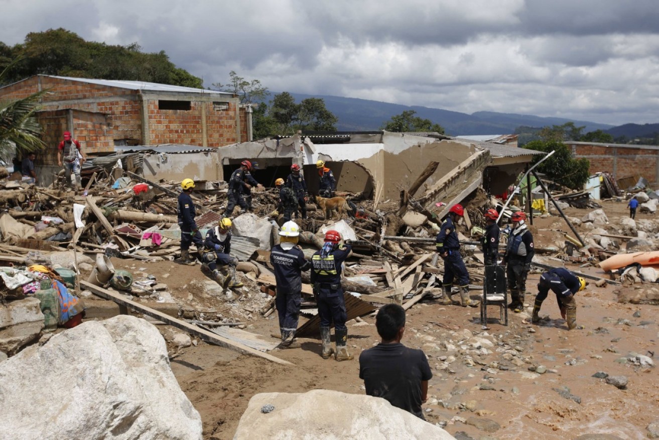 Emergency services search for survivors amid the landsldie rubble in Mocoa, Colombia. 