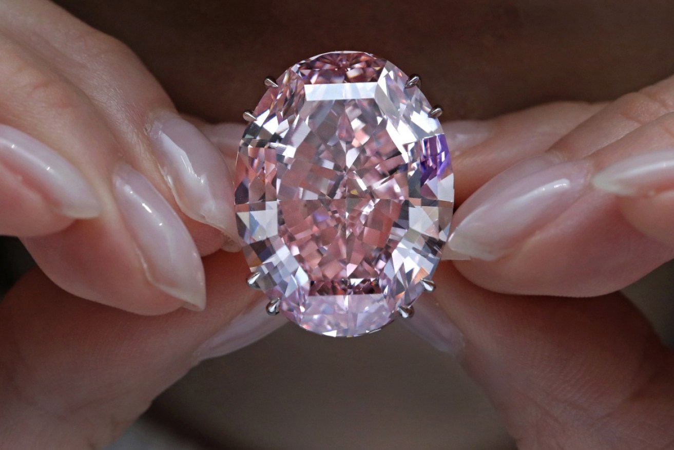 The diamond has sold in what is believed to be an auction record level for a precious gem. 