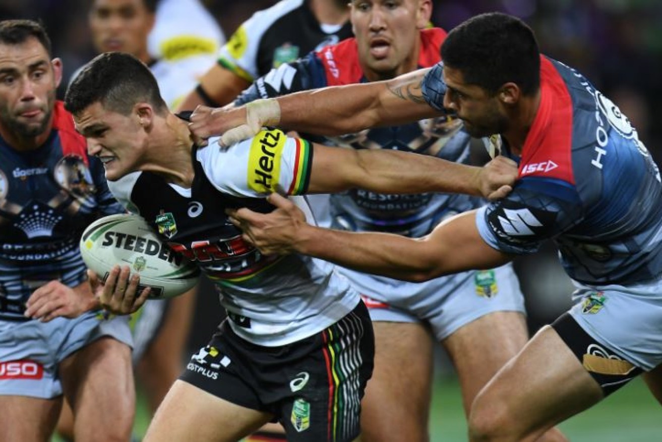 Jesse Bromwich (right) puts the handbrake on Nathan Cleary to foil yet another ill-fated Panthers bid for the try line.