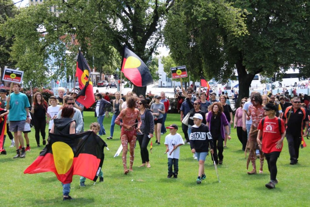 About 1,000 members of Tasmania's Aboriginal community protested at Parliament House on Australia Day.