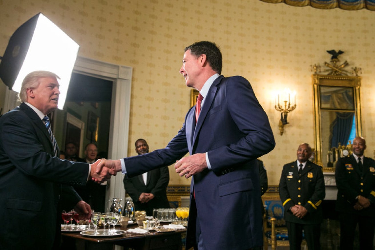 President Trump and James Comey during a reception at the White House for law enforcement officials days after the inauguration.
