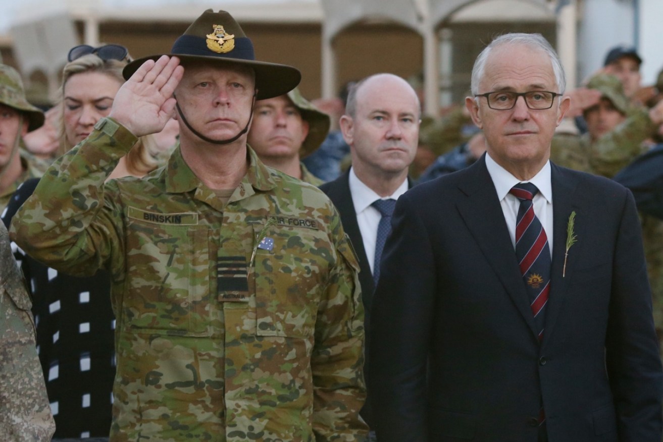 Prime Minister Malcolm Turnbull attends an ANZAC Day ceremony with Chief of the Defence Force Air Marshall Mark Binskin. 
