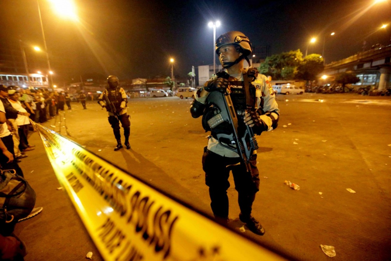 Two suspected suicide bombers blew themselves up at a busy bus terminal in Jakarta, killing themselves and three police officers.