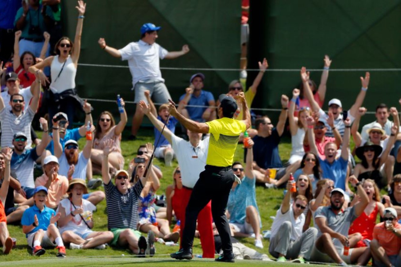 The crowd's applause matches Jason Day's delight after the Australian sinks a 20-metre putt in Texes on Saturday.