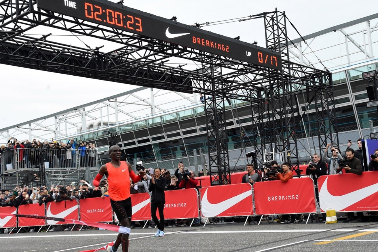Eliud Kipchoge crosses the finish line (his time was later adjusted).