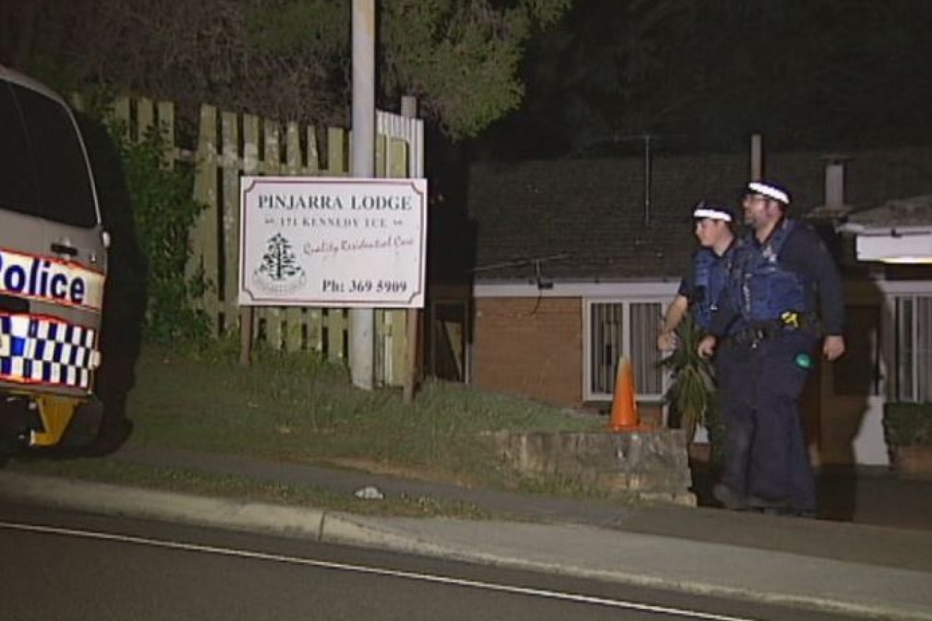 Police converged on Pinjarra Lodge, a Brisbane half-way house, where they found one man fatally and three others wounded.
