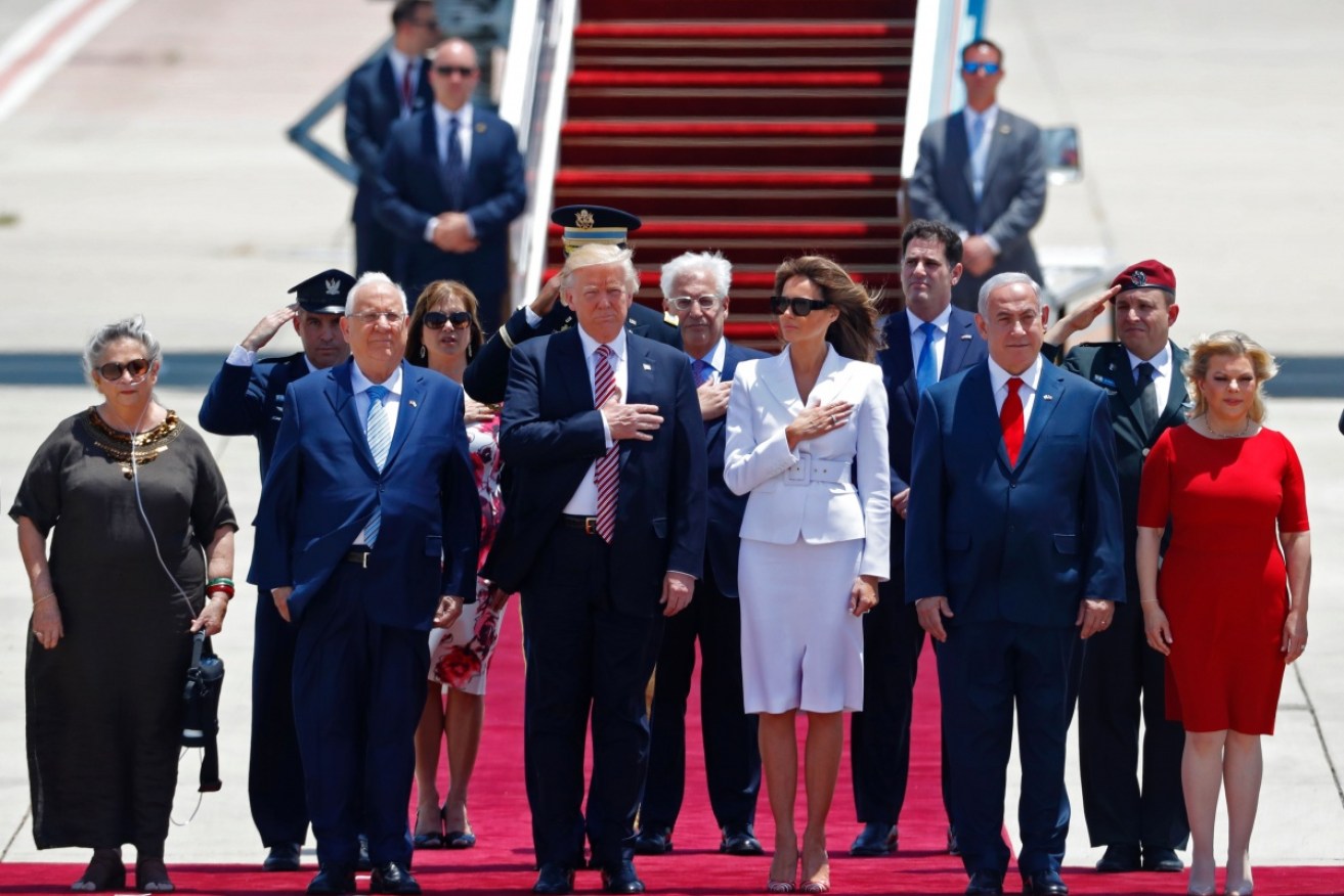 Donald Trump and wife Melania (centre) arriving in Israel.