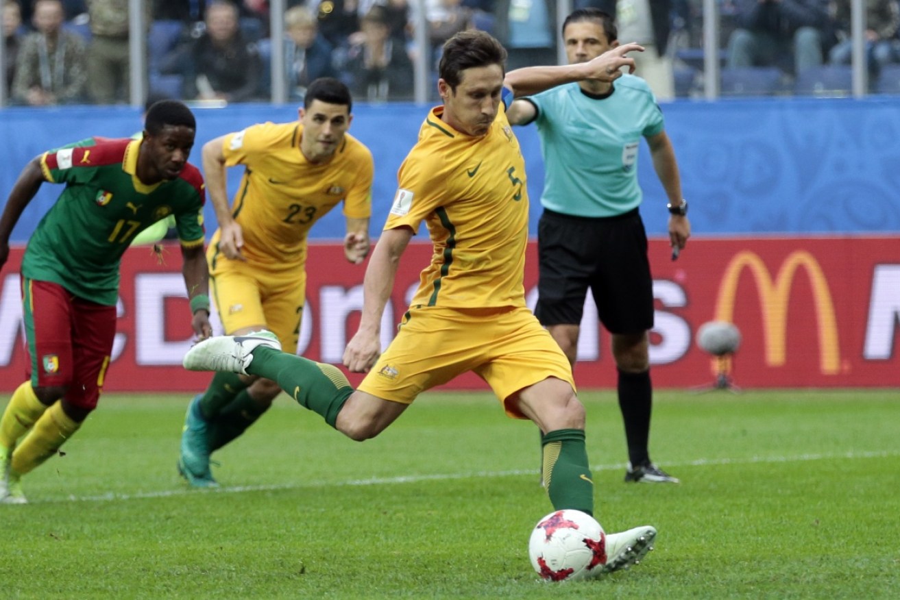 Mark Milligan's second half penalty helped Australia steal a point in its match with Cameroon.