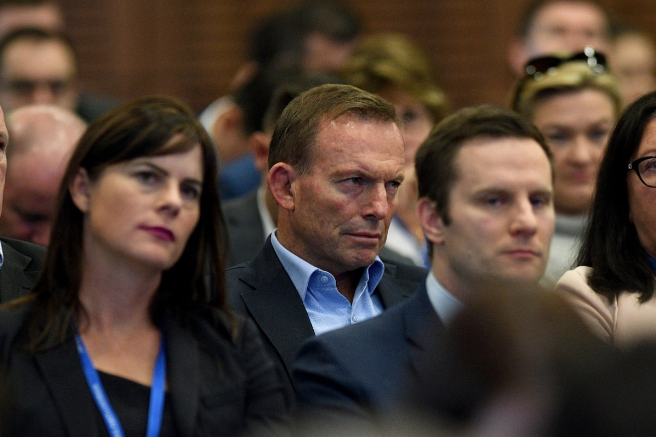 Former PM Tony Abbott watches on as Prime Minister Malcolm Turnbull delivers an address at the 59th Liberal Party Federal Council Meeting on June 24.