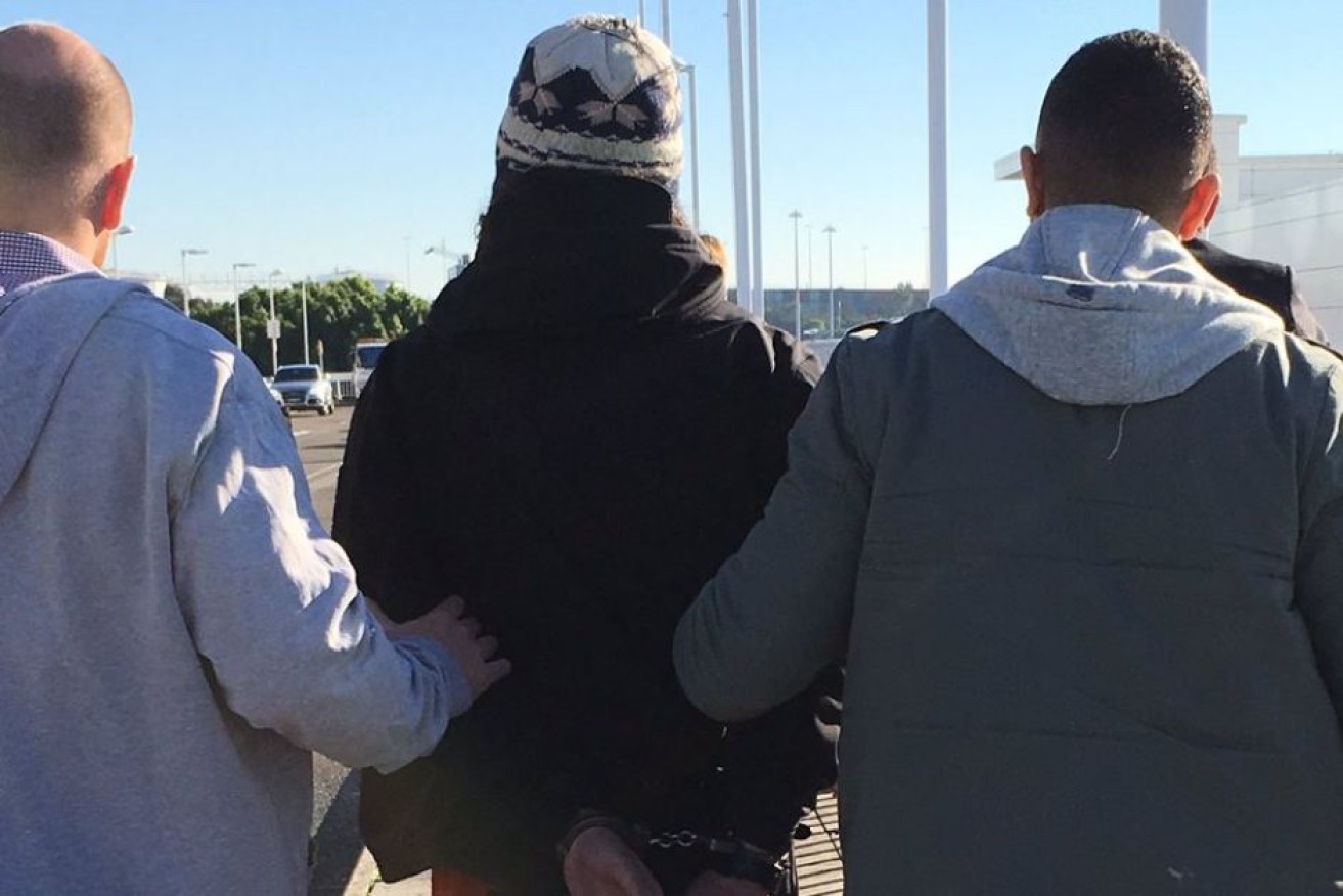 A 22-year-old man was allegedly attempting to leave Australia for Syria.