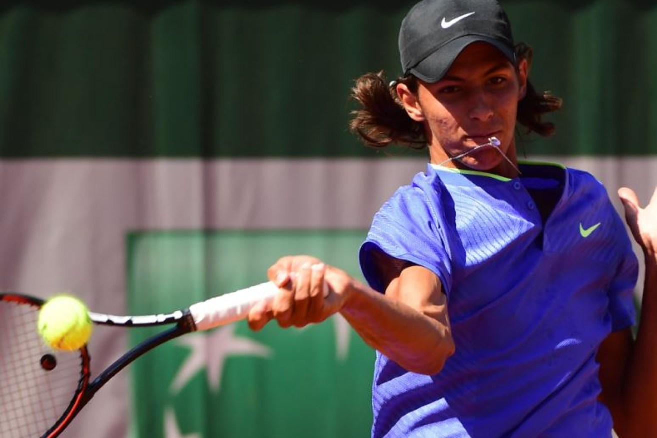 Alexei Popyrin, 17, puts some runs on the board for Australia as he claims the Junior French Open crown.