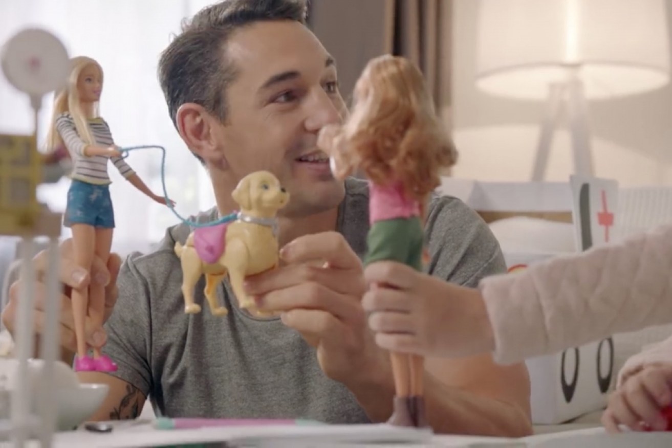 Billy Slater playing with Barbies with his daughter.