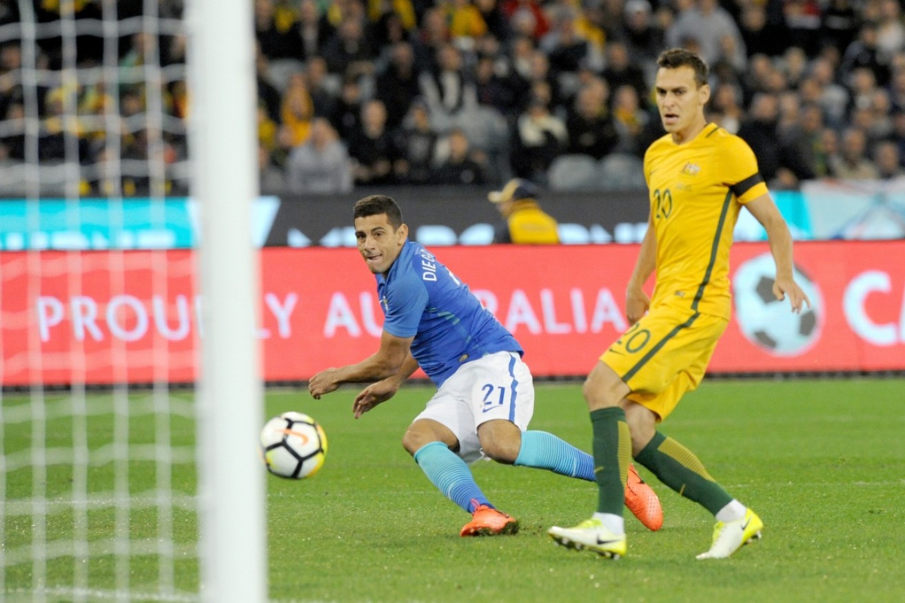 Diego Souza opens the scoring for Brazil in the first 12 seconds of the friendly against Australia.