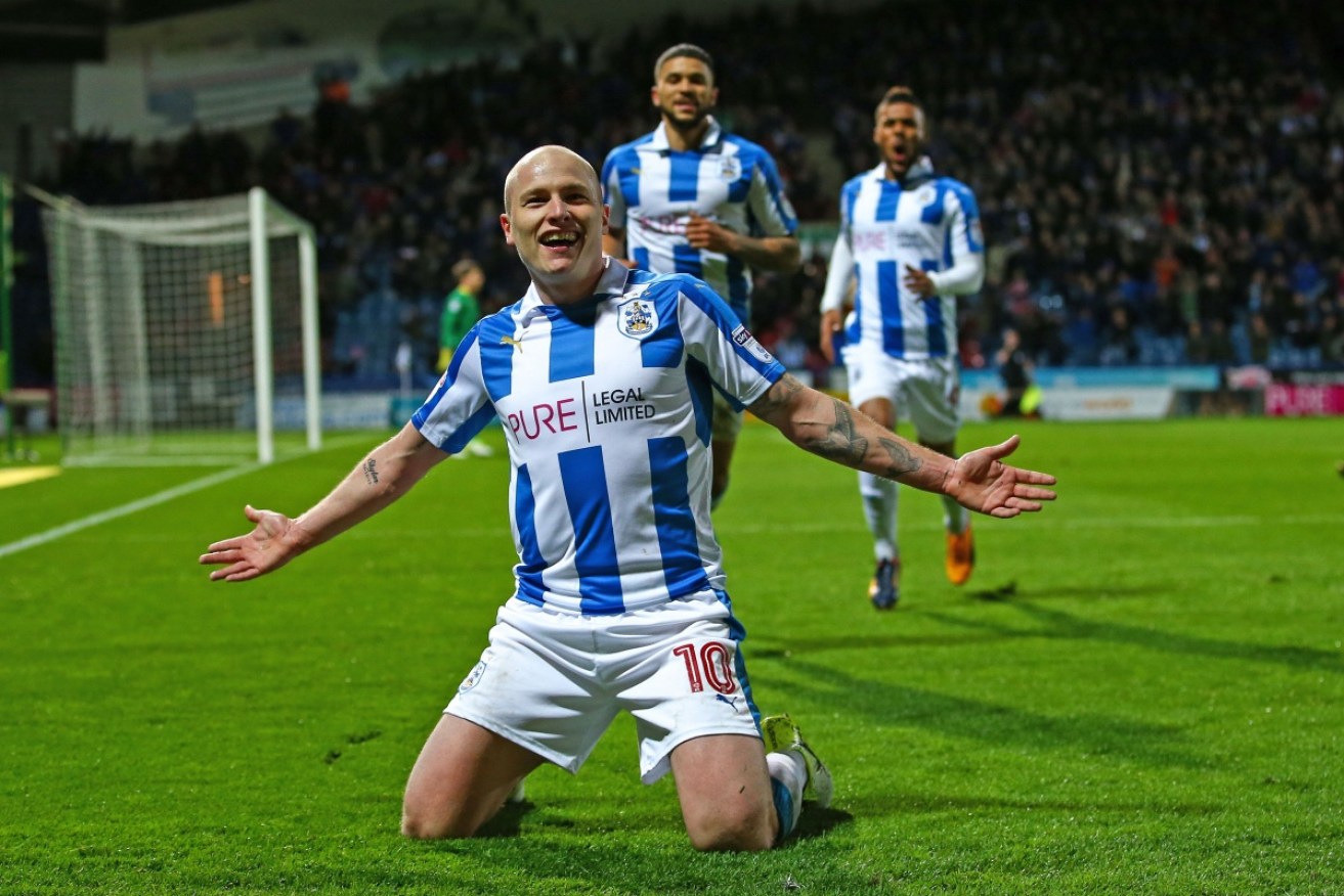 Aaron Mooy has sealed a permanent move to Premier League side Huddersfield in a record signing,