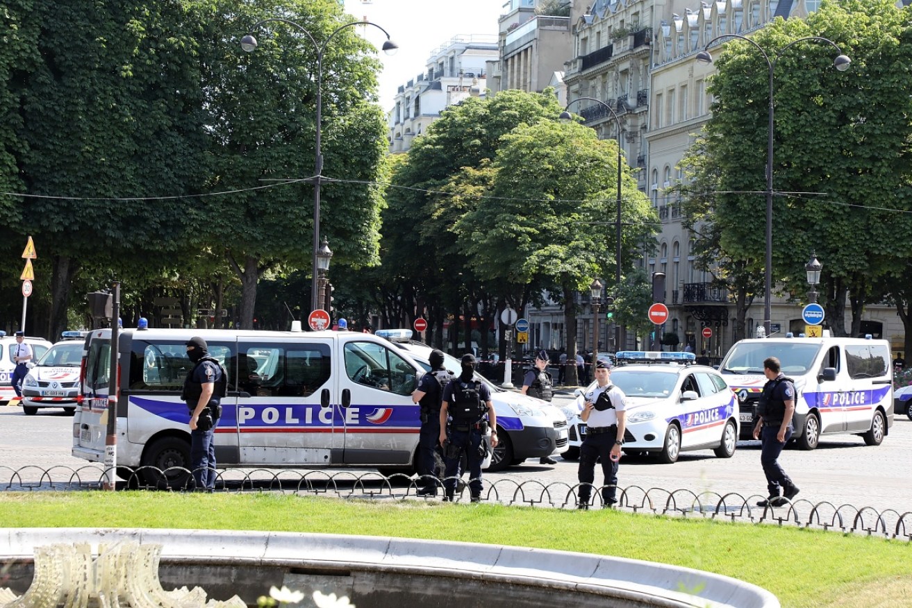 The popular Champs Elysees in Pais was evacuated after a car carrying weapons and explosives rammed a police van.