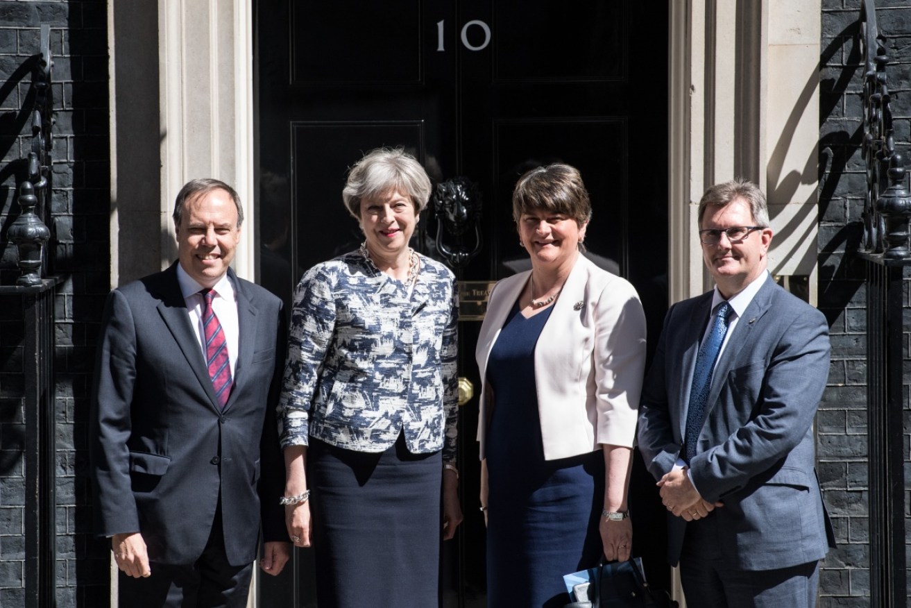 Theresa May has sealed a costly deal with Northern Ireland's DUP to secure minority government.