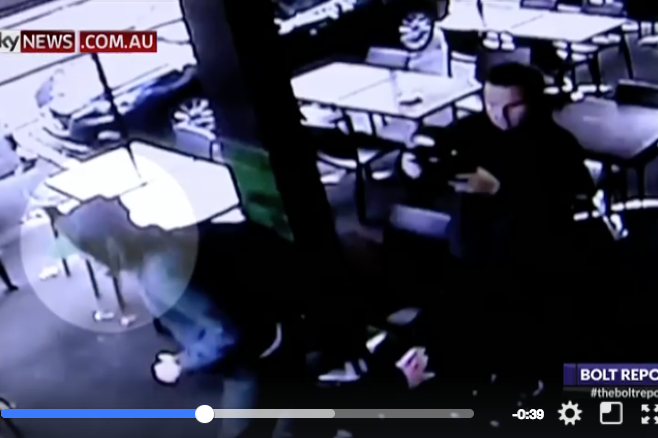 CCTV footage captured the attack on Andrew Bolt by protesters.
